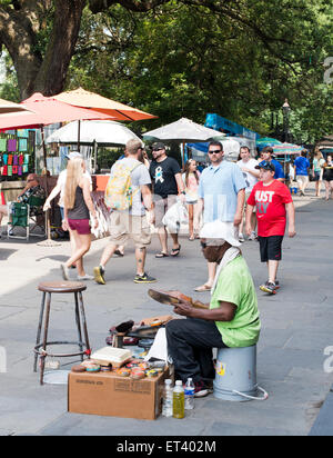 Shoe shine vendor at a city park in New Orleans Louisiana Stock Photo