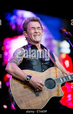 Berlin, Germany. 09th June, 2015. German singer Peter Maffay performs on stage as he kicks off his new tour entitled 'Niemals war es besser' (lit. It has never been better) at the Kindl-Buehne Wuhlheide in Berlin, Germany, 09 June 2015. Photo: Gregor Fischer/dpa/Alamy Live News Stock Photo