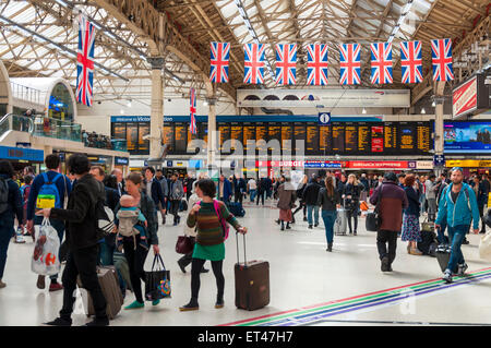 Passengers at Victoria railway station London, UK Stock Photo