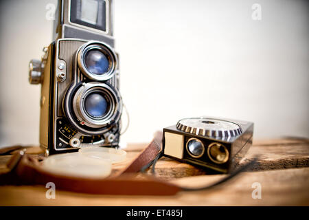 old twin-lens reflex camera with light meter on the white background Stock Photo