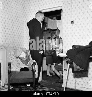 Slums, Benburb street area of Dublin, Republic of Ireland, 11th May 1968. Dublin slums controlled by the municipal authority, the Dublin Corporation, which has had to ignore standards of hygiene and sanitation. Pictured. Father Michael Sweetman, a priest Stock Photo