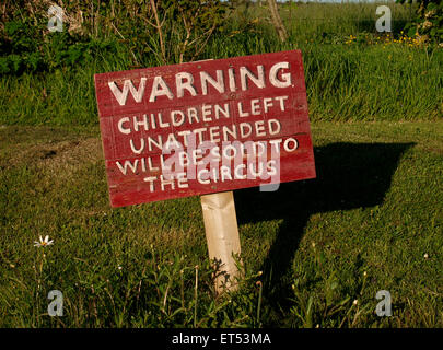 Fun sign, Warning children left unattended will be sold to the circus, UK