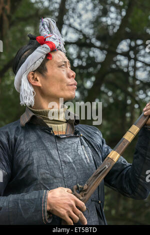 Portrait of a Basha Miao gunman, Basha Gun Village, Guizhou Province, China Stock Photo