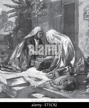 General View The famine in India women grinding corn Stock Photo