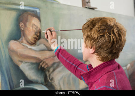 Female artist painting, Bavaria, Germany Stock Photo