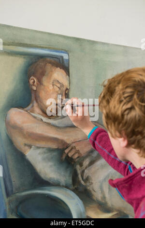 Female artist painting, Bavaria, Germany Stock Photo