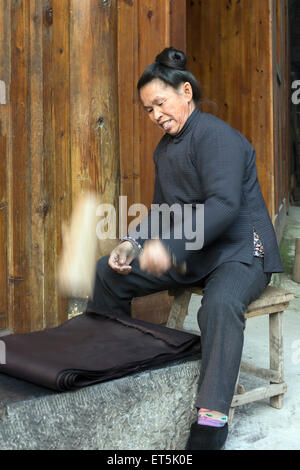 Dong Ethnic Minority Woman Pounding Colour into Indigo Cloth Zhaoxing ...