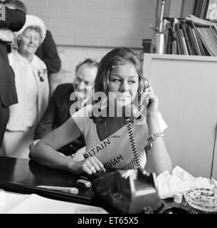 Carole Fletcher, 19 from Southport, crowned Miss Great Britain, in Morecambe, 31st August 1966. Pictured on telephone to fiancee. Stock Photo