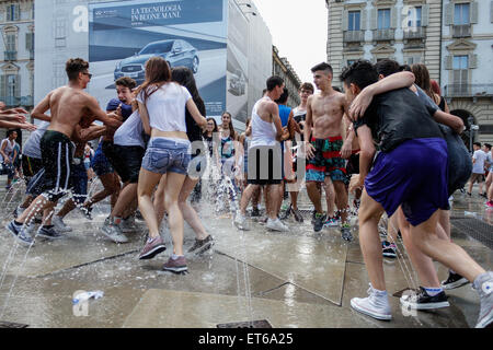 Turin, Italy. 11th June, 2015. Hundreds of students came together to celebrate the last day of school. It's tradition to bathe in the fountains of Castle Square between joy and fun. Credit:  Elena Aquila/Pacific Press/Alamy Live News Stock Photo