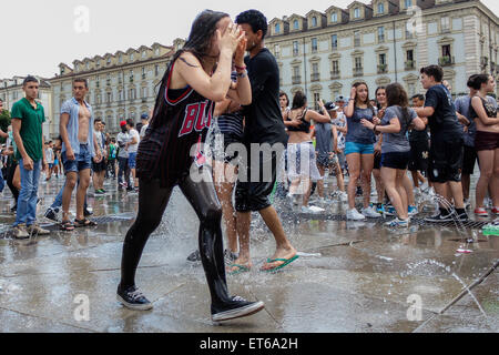 Turin, Italy. 11th June, 2015. Hundreds of students came together to celebrate the last day of school. It's tradition to bathe in the fountains of Castle Square between joy and fun. Credit:  Elena Aquila/Pacific Press/Alamy Live News Stock Photo
