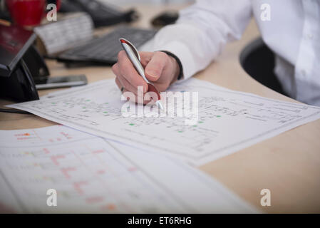 Engineer analysing wiring diagram, Munich, Bavaria, Germany Stock Photo