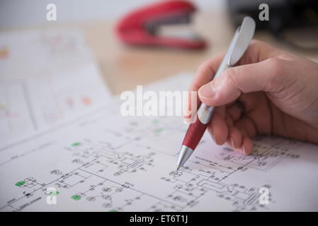 Engineer analysing wiring diagram, Munich, Bavaria, Germany Stock Photo