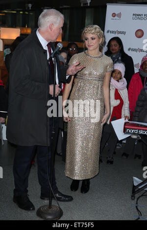 Pixie Lott performs with children from Copenhagen Primary School in aid of Penny for London at St. Pancras International  Featuring: Pixie Lott Where: London, United Kingdom When: 16 Dec 2014 Credit: Phil Lewis/WENN.com Stock Photo