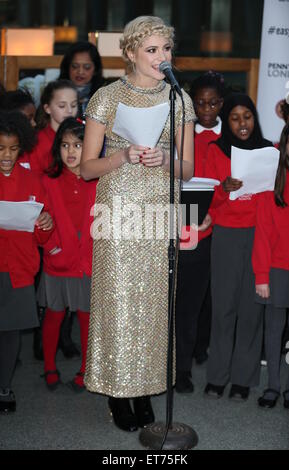 Pixie Lott performs with children from Copenhagen Primary School in aid of Penny for London at St. Pancras International  Featuring: Pixie Lott Where: London, United Kingdom When: 16 Dec 2014 Credit: Phil Lewis/WENN.com Stock Photo