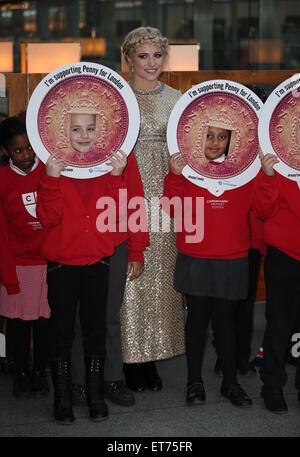 Pixie Lott performs with children from Copenhagen Primary School in aid of Penny for London at St. Pancras International  Featuring: Pixie Lott Where: London, United Kingdom When: 16 Dec 2014 Credit: Phil Lewis/WENN.com Stock Photo