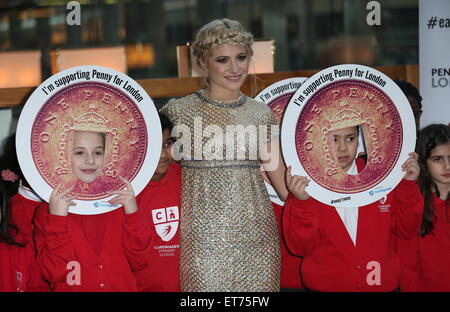 Pixie Lott performs with children from Copenhagen Primary School in aid of Penny for London at St. Pancras International  Featuring: Pixie Lott Where: London, United Kingdom When: 16 Dec 2014 Credit: Phil Lewis/WENN.com Stock Photo