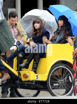 Zooey Deschanel filming a new episode of the hit FOX tv show 'New Girl'  on a rainy day in Los Angeles  Featuring: Zooey Deschanel, Hannah Simone, Jake Johnson Where: Los Angeles, California, United States When: 16 Dec 2014 Credit: Cousart/JFXimages/WENN.com Stock Photo