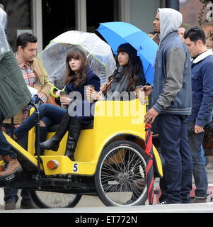 Zooey Deschanel filming a new episode of the hit FOX tv show 'New Girl'  on a rainy day in Los Angeles  Featuring: Zooey Deschanel, Hannah Simone, Jake Johnson, Damon Wayans Jr Where: Los Angeles, California, United States When: 16 Dec 2014 Credit: Cousart/JFXimages/WENN.com Stock Photo