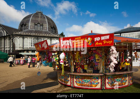 UK, England, Derbyshire, Buxton, Pavilion Gardens, Octagon, and Family Festival fairground stall Stock Photo