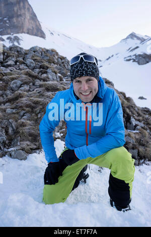 Portrait of male skier on snow covered mountain, Tyrol, Austria Stock Photo