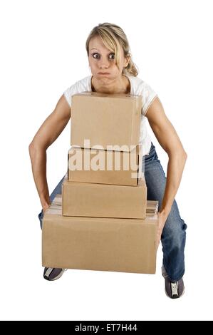 junge Frau transportiert Kartons, Deutschland | young woman carrying boxes, Germany Stock Photo