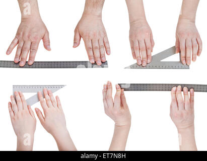 set of hands with metallic rulers isolated on white background Stock Photo