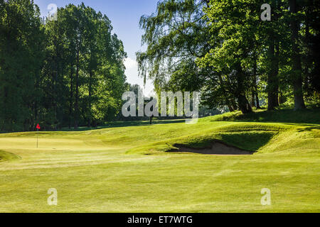 A typical golf course in early morning sunshine. Stock Photo