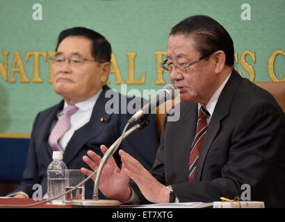 Tokyo, Japan. 12th June, 2015. Taku Yamazaki, one of four former members of the Liberal Democratic Party, voices his opposition to the government sponsored security-related bills during a joint news conference at the Japan National Press Club in Tokyo on Friday, June 12, 2015. All four old boys have something in common - they have something to say about everything, specially when it comes to the reinterpretion of the constitution by Prime Minister Shinzo Abe to allow the government to dispatch military forces overseas in collective self-defense. At left is Shizuka Kamei. © Aflo Co. Ltd./Alamy  Stock Photo