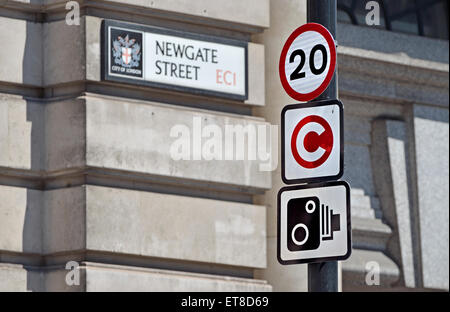 London, England, UK. Traffic signs in Newgate Street - 20 mph limit; congestion zone; speed cameras. Stock Photo