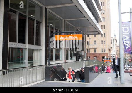 signage above entrance to Martin Place railway station in Martin place,Sydney city centre,australia as people exit the station Stock Photo