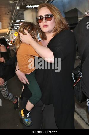 Adele arrives at Los Angeles International (LAX) airport carrying her son Angelo  Featuring: Adele Adkins, Angelo Konecki Where: Los Angeles, California, United States When: 03 Jan 2015 Credit: WENN.com Stock Photo