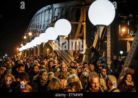 Berlin, Germany, balloons of light limit and visitors at the Bornholmer Strasse Stock Photo