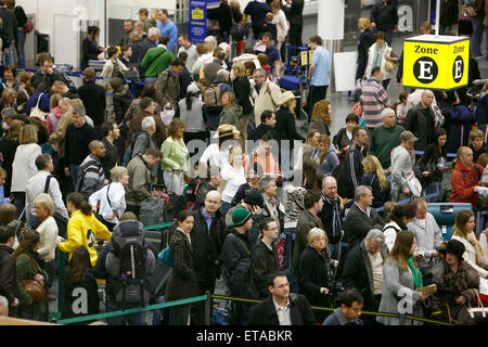 Travelers in the South terminal of London's Gatwick Airport queue to check in.Picture by James Boardman Stock Photo