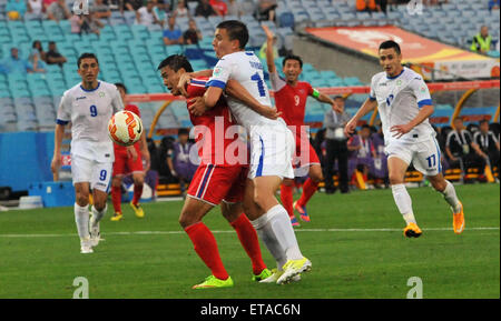 2015 AFC finals match Uzbekistan vs. DPR Korea. Uzbekistan struggled to defeat a gallant DPR Korea in their first pool match.  Featuring: Igor Sergeev, Jang Kuk Chol Where: Sydney, Australia When: 10 Jan 2015 Credit: WENN.com Stock Photo