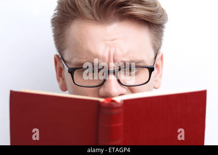 Smart guy involved in reading Stock Photo