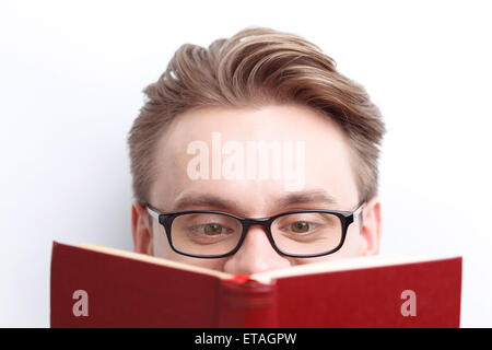 Smart guy involved in reading Stock Photo