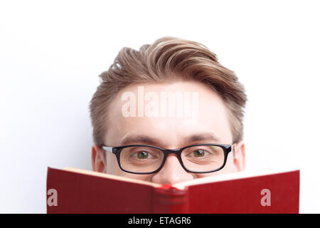 Smart guy involved in reading Stock Photo