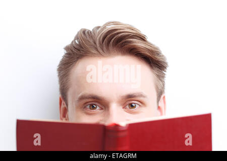 Smart guy involved in reading Stock Photo