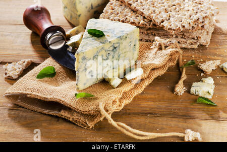 Blue cheese on wooden background. Selective focus Stock Photo