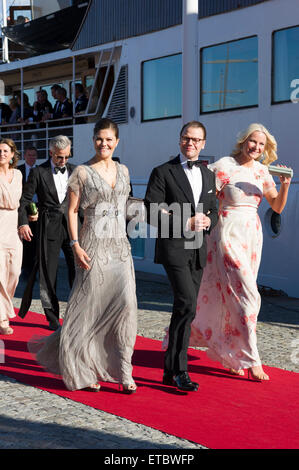 Stockholm, Sweden, June, 12, 2015. Private guests arrives at Strandvagen, Stockholm to board the Archipelago ship s/s Stockholm for further transport to the festivities. This is the start of the celebration of the marriage between Prince Carl Philip and Ms Sofia Hellqvist that will take place tomorrow at the Royal Chapel, Stockholm. Crown Princess Victoria and Prince Daniel, Sweden, Crown Princess Mette-Marit, Norway (left to right). Credit:  Barbro Bergfeldt/Alamy Live News Stock Photo