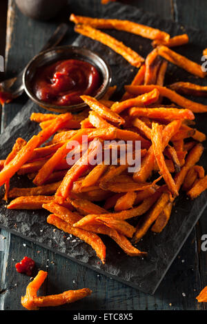 Homemade Orange Sweet Potato Fries with Salt and Pepper Stock Photo