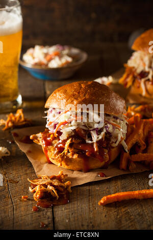 Homemade Pulled Chicken Sandwich with Coleslaw and Fries Stock Photo