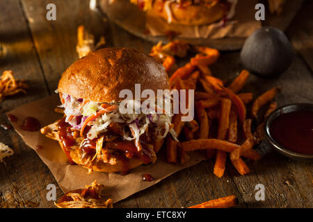 Homemade Pulled Chicken Sandwich with Coleslaw and Fries Stock Photo
