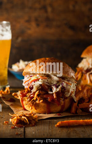 Homemade Pulled Chicken Sandwich with Coleslaw and Fries Stock Photo