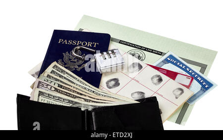 Passport, fingerprint card, driver's license, social security card and birth certificate isolated on white with US currency, wal Stock Photo