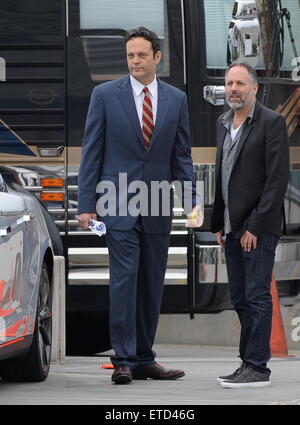 Actor Vince Vaughn wearing a blue suit while eating an apple on the set of 'Unfinished Business' filming in Los Angeles Ca.  Featuring: Vince Vaughn Where: Los Angeles, California, United States When: 20 Jan 2015 Credit: Cousart/JFXimages/WENN.com Stock Photo