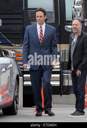 Actor Vince Vaughn wearing a blue suit while eating an apple on the set of 'Unfinished Business' filming in Los Angeles Ca.  Featuring: Vince Vaughn Where: Los Angeles, California, United States When: 20 Jan 2015 Credit: Cousart/JFXimages/WENN.com Stock Photo