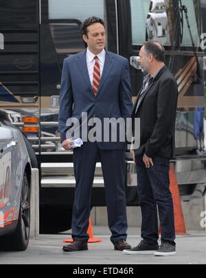 Actor Vince Vaughn wearing a blue suit while eating an apple on the set of 'Unfinished Business' filming in Los Angeles Ca.  Featuring: Vince Vaughn Where: Los Angeles, California, United States When: 20 Jan 2015 Credit: Cousart/JFXimages/WENN.com Stock Photo