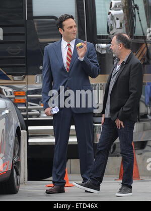 Actor Vince Vaughn wearing a blue suit while eating an apple on the set of 'Unfinished Business' filming in Los Angeles Ca.  Featuring: Vince Vaughn Where: Los Angeles, California, United States When: 20 Jan 2015 Credit: Cousart/JFXimages/WENN.com Stock Photo