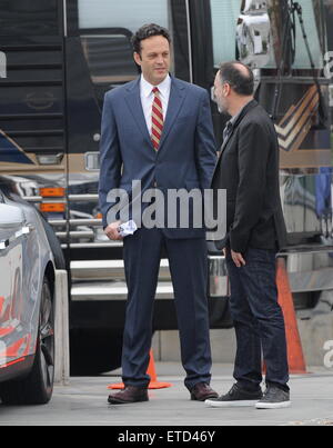 Actor Vince Vaughn wearing a blue suit while eating an apple on the set of 'Unfinished Business' filming in Los Angeles Ca.  Featuring: Vince Vaughn Where: Los Angeles, California, United States When: 20 Jan 2015 Credit: Cousart/JFXimages/WENN.com Stock Photo